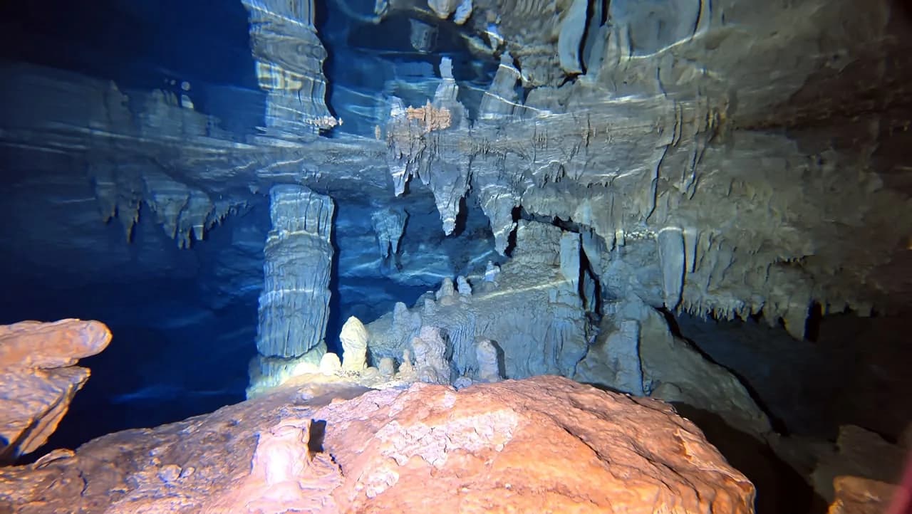 Blue water in the cavern chamber