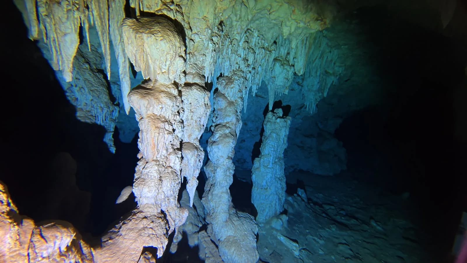 The vault of the cave, lit from below