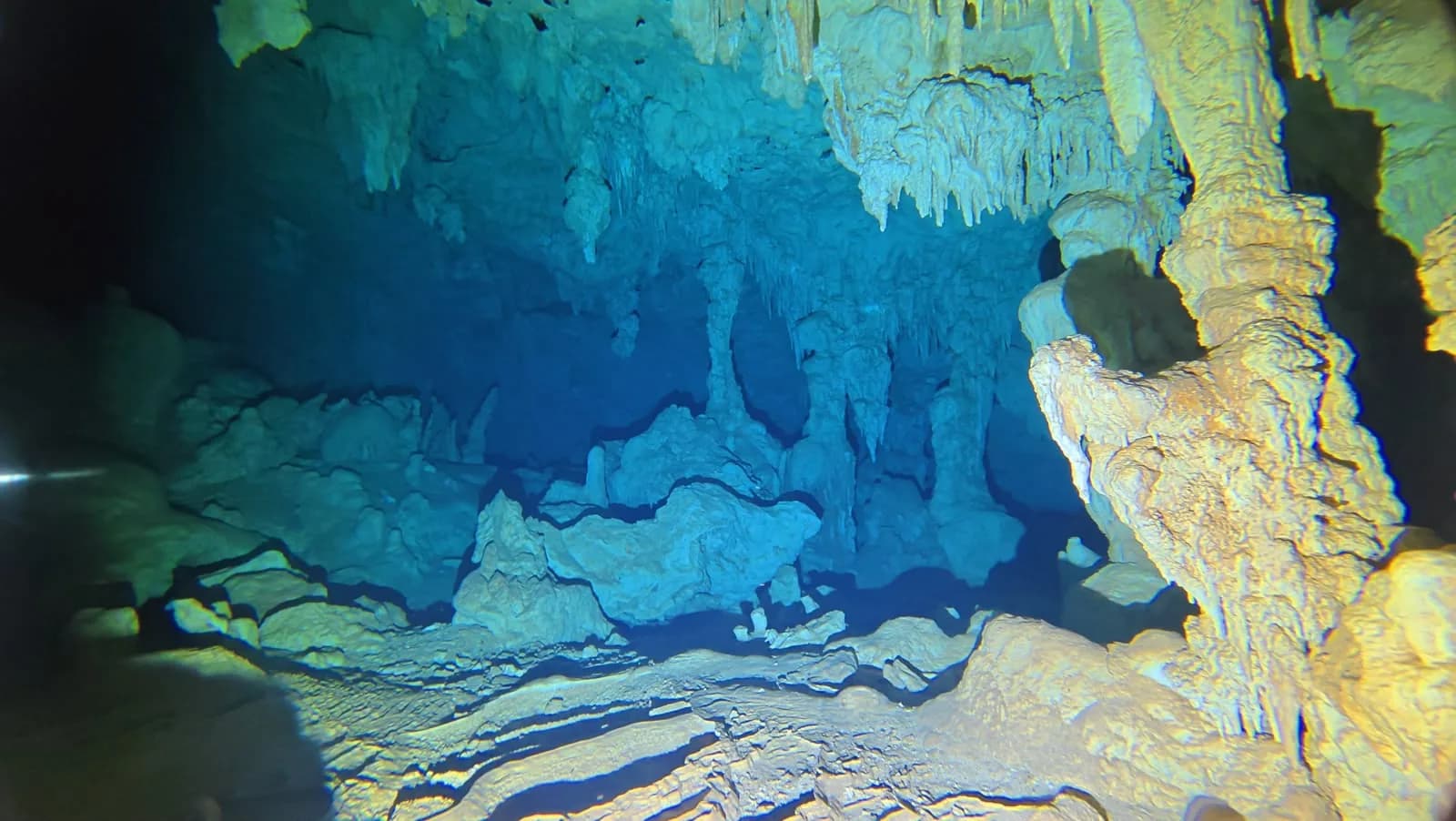 A stalactite hanging over the water